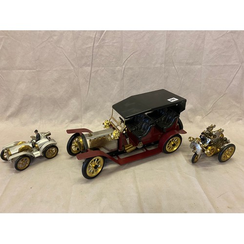 284 - A steam driven model of a vintage car and two Hermann Bohm Stirling car models