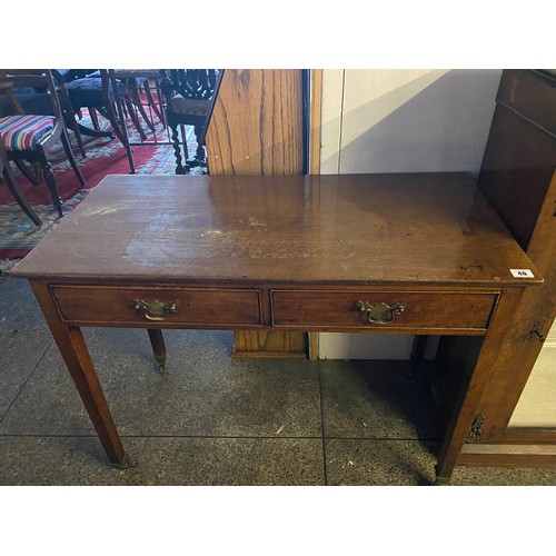 40 - A Georgian design mahogany sidetable fitted two drawers, on tapering legs terminating in brass casto... 