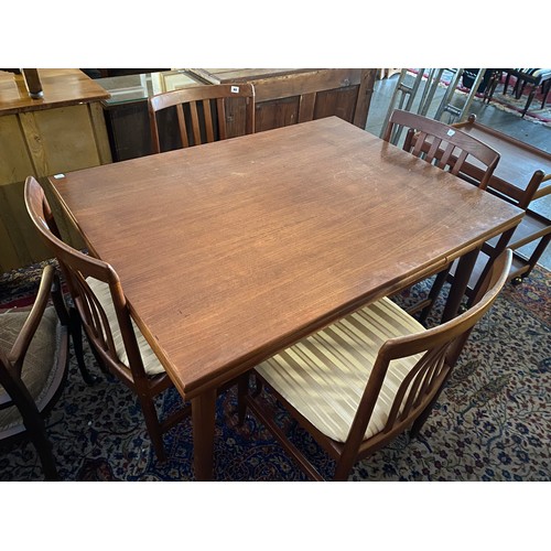 88 - A Takenaka teak dining room suite comprising:- drawleaf dining table, four chairs with vertical spla... 