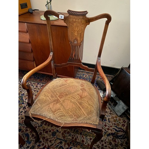 38 - An Edwardian mahogany and inlaid open armchair with pierced centre splat, on cabriole legs, carved c... 