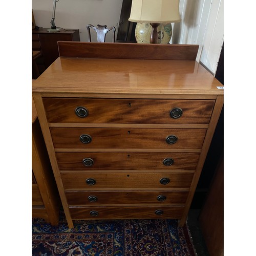 92 - A walnut straight front chest with low raised back,  fitted six drawers - 30in. wide