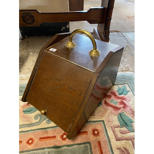 52 - An oak coal box with brass carrying handle