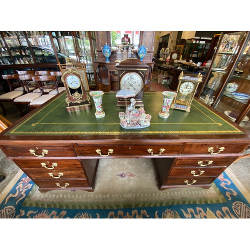 53 - A mahogany partners desk with green and gilt tooled leather top, fitted three frieze drawers to each... 