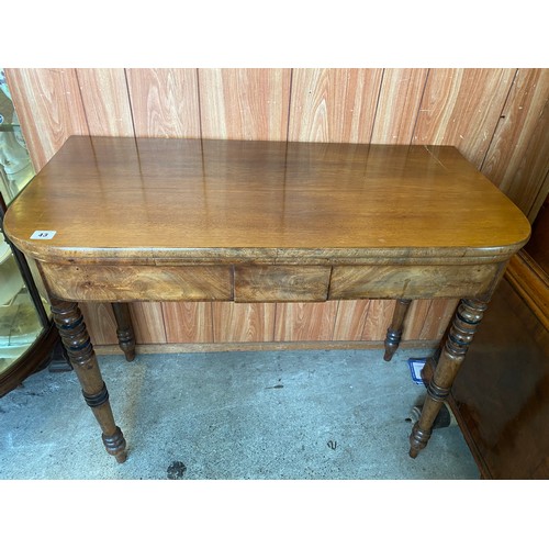 43 - A Georgian mahogany card table with 'D' shaped folding top, on turned legs - 36in. wide