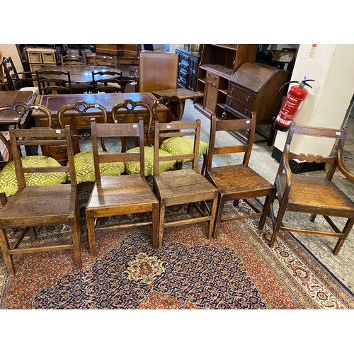 33 - Five (including one carver) George III period country oak framed dining chairs with panelled crestin... 