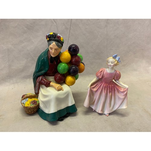 125 - Two Royal Doulton figures - The Old Balloon Seller HN1315 and Sweeting HN1935