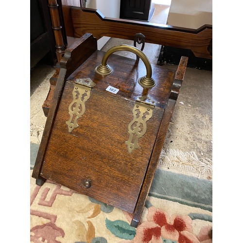 102 - A Victorian oak coal box and a brass warming pan with turned wood handle