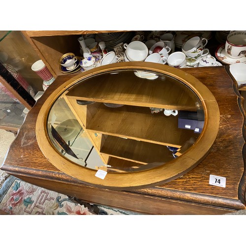 103 - An Edwardian mahogany tub chair, two Victorian mahogany framed dining chairs and an oval wall mirror... 