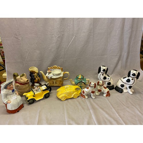 149 - Four novelty teapots including a yellow Sadler racing car, plaster bookends, three character Toby ju... 