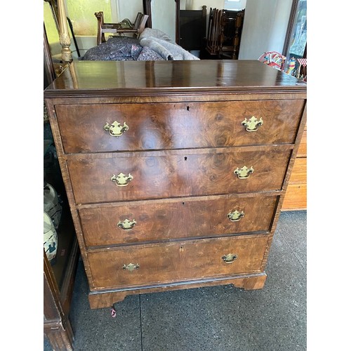 37 - A walnut veneered straight front fitted four wide drawers - 36in. wide