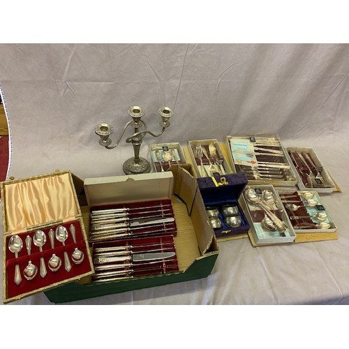 189 - A plated twin branch candelabra, a selection of Sheffield silver plated flatware boxed, a set of fou... 