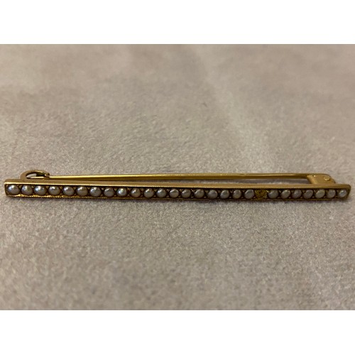 224 - A gold coloured metal bar brooch set seed pearls and a gold coloured metal regimental bar brooch, th... 