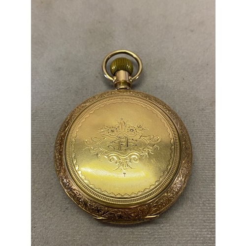 201 - A gentleman's Elgin pocket watch, white enamel dial, seconds dial, on a gimbal, in a gold plated cas... 