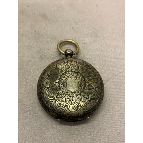 253 - A lady's openface fob watch in a silver case with engraved decoration