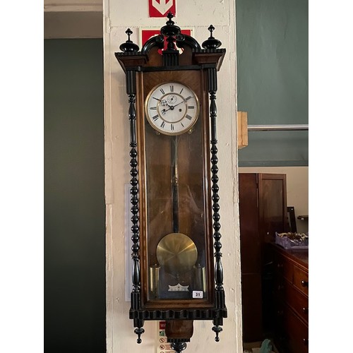 31 - A Vienna regulator wall clock with white enamel dial, twin weight movement, in a mahogany case