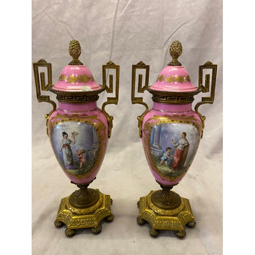 119 - A pair of Paris porcelain covered urns, the lids with pineapple finials, key pattern handles and nec... 