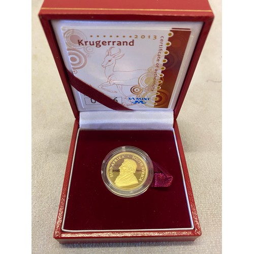 255 - A 2013 1/4 proof Krugerrand with certificate in fitted red leather box