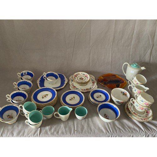 102 - A Grafton china part tea service, a part tea service decorated flowers within blue mottled border, a... 