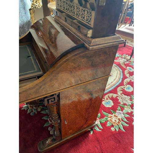 22 - A Victorian walnut and satinwood inlaid Davenport with pop up stationery compartment, hinged writing... 