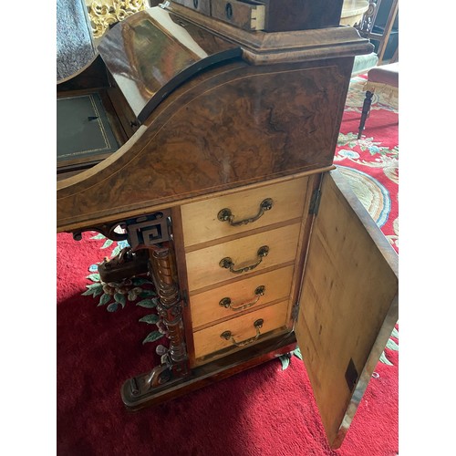 22 - A Victorian walnut and satinwood inlaid Davenport with pop up stationery compartment, hinged writing... 