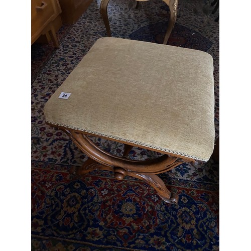 60 - A Victorian walnut framed stool with 'X' shaped frame