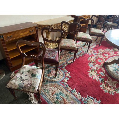 54 - A Victorian walnut veneered circular breakfast table with carved frieze, on barley twist supports an... 