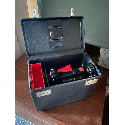 41 - A Singer sewing machine in black case