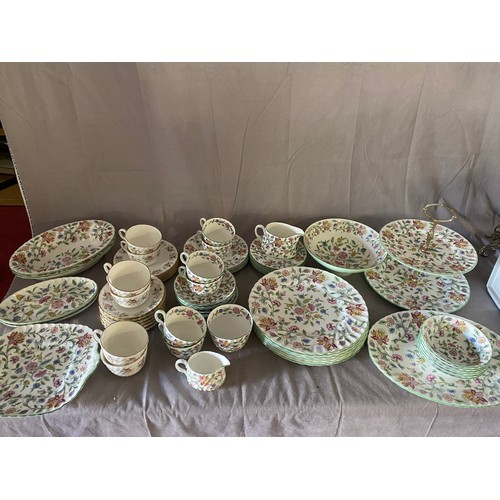 127 - A Minton Haddon Hall pattern part tea and dinner service comprising:- six cups and saucers, cream ju... 