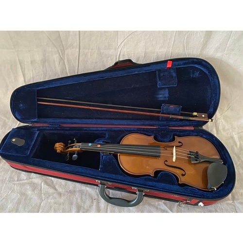 290 - A violin and bow in fitted case and outer red fabric case