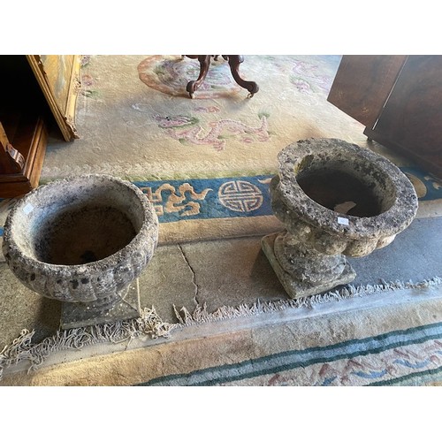 66 - A pair of concrete garden urns on pedestal bases and two similar urns