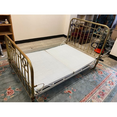 25 - A Victorian brass 4ft. 6in. bed frame