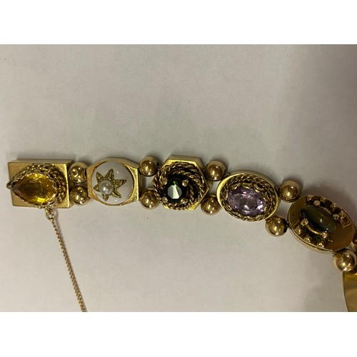 263 - A 14kt. gold bracelet, the shaped links set with semi precious stones, enamel, cameos etc. with bead... 