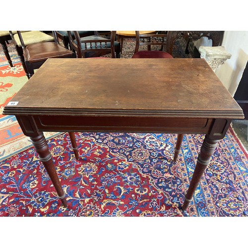 43 - A 19th Century mahogany side table with rectangular top, on turned legs - 31in. wide