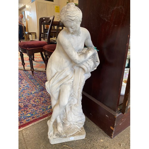 55 - A concrete garden statue in the form of a classical lady holding an urn - 33in. high and a similar d... 