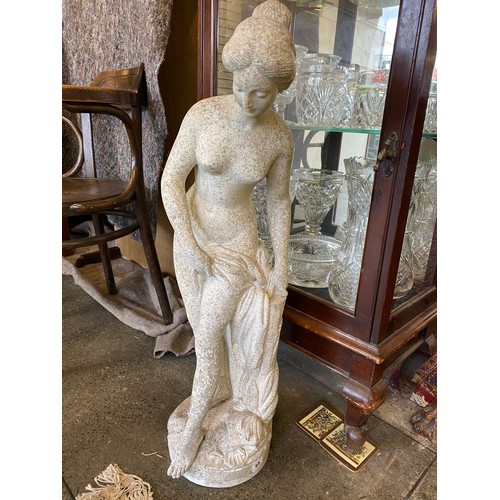 55 - A concrete garden statue in the form of a classical lady holding an urn - 33in. high and a similar d... 