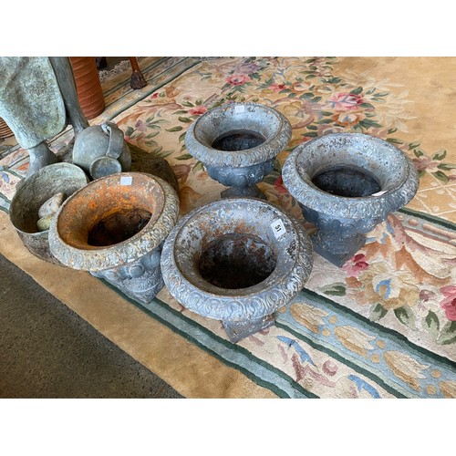 51 - Four cast iron garden urns - 10in. high