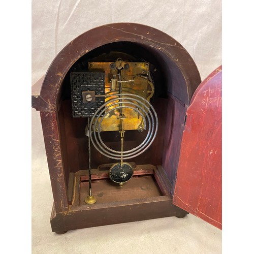 296 - An Edwardian mantel clock with circular silvered dial, in a mahogany and inlaid case