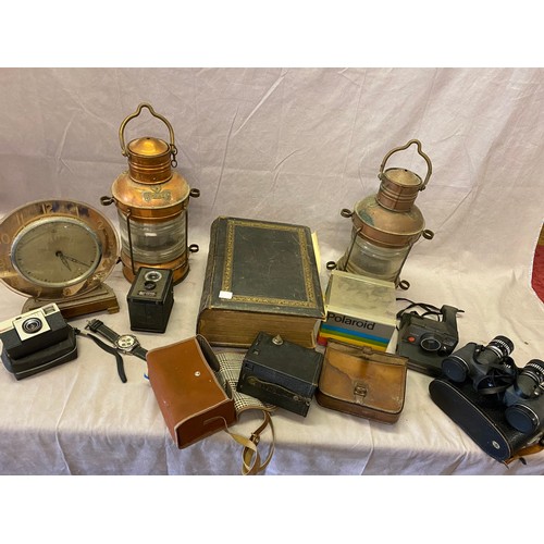 307 - Two copper cased ships lantern, an Art Deco Bulle mantel clock in a peach mirrored glass case, a sel... 