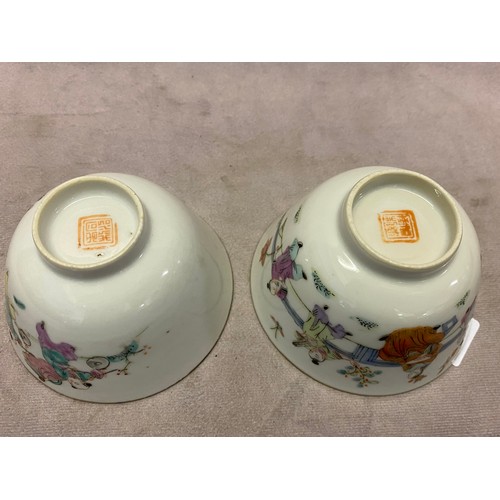 111 - Two Chinese Republic style porcelain tea bowls decorated figures and flowers, both 4in. dia. approx.