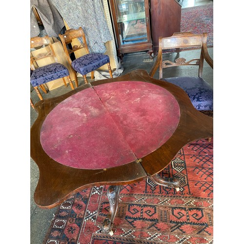 72 - A Victorian burr walnut veneered card table with shaped folding top, carved column, on four downswep... 