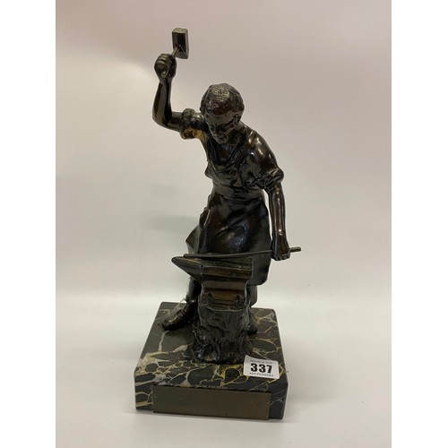 337 - A bronze study of a blacksmith on black variegated marble base - 13in. high