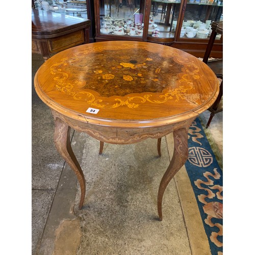 54 - A French kingwood and floral marquetry table with circular top, on slender cabriole legs - 27in. dia... 