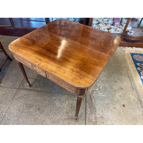 115 - A Georgian mahogany card table with 'D' shaped folding top, on fluted legs terminating in castors - ... 