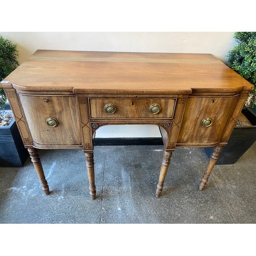 42 - A Georgian mahogany sideboard fitted centre drawer flanked to each side by cellaret and cupboard, on... 