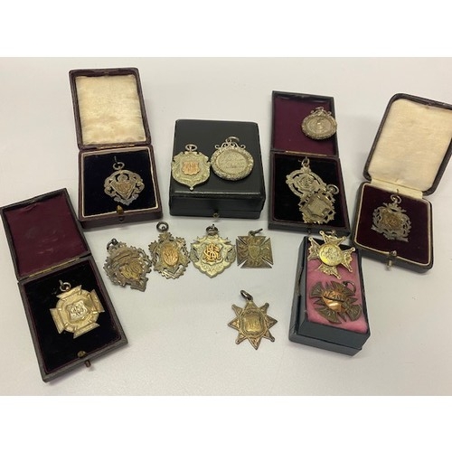 323 - A selection of silver and other presentation medallions