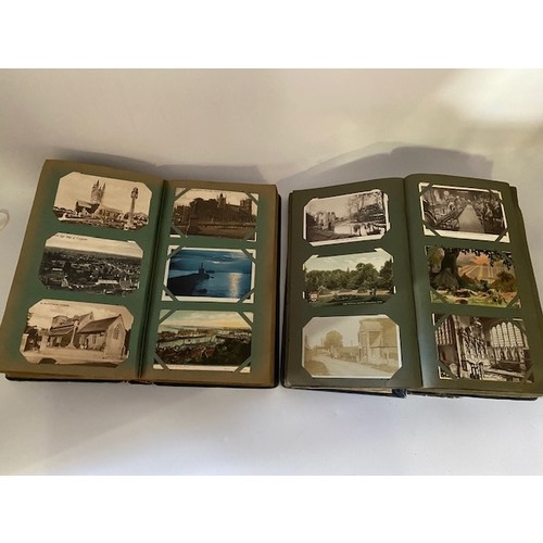 33 - Two Edwardian postcard albums containing black and white and coloured postcards