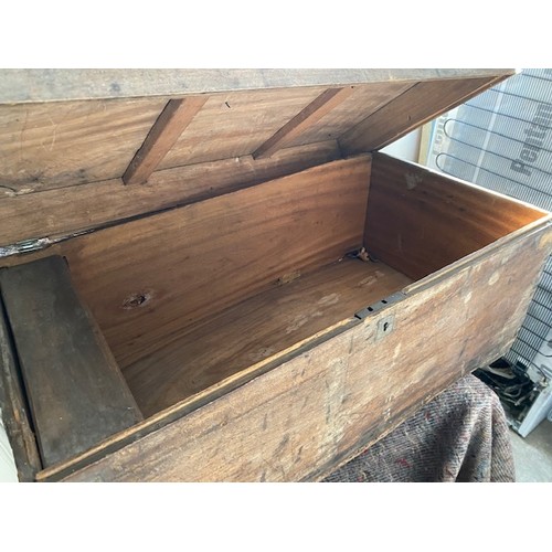 175 - A pine trunk, the interior fitted box, end carrying handles, on platform base - 31in. wide