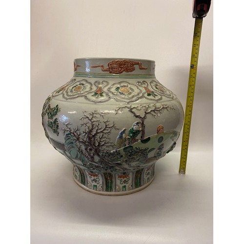 1161 - A large 19th Century Chinese bulbous vase with raised decoration of figures and flowers in famille v... 