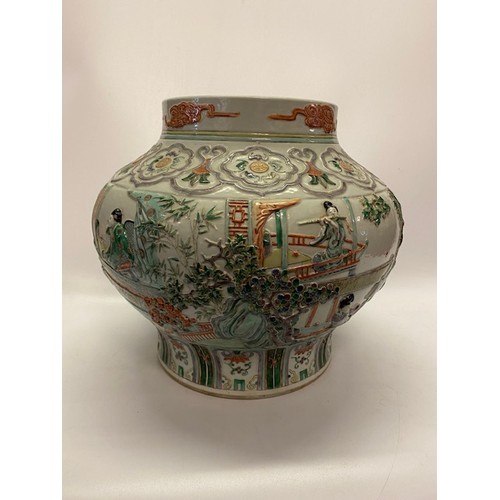 1161 - A large 19th Century Chinese bulbous vase with raised decoration of figures and flowers in famille v... 