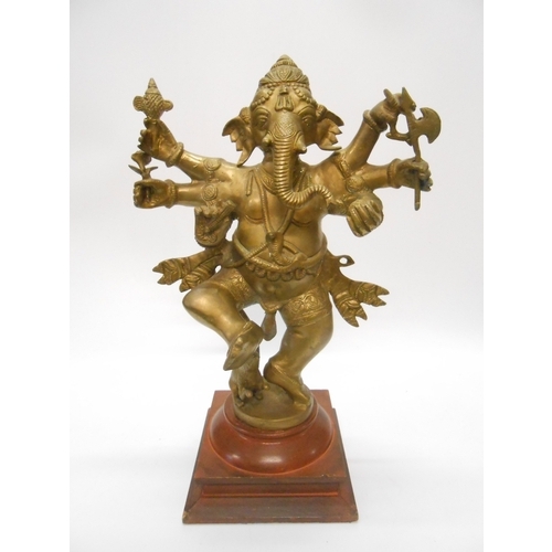 1333 - An Indian brass finished figure of Ganesh, on base - 18in. high and an Indian brass finished wall ma... 